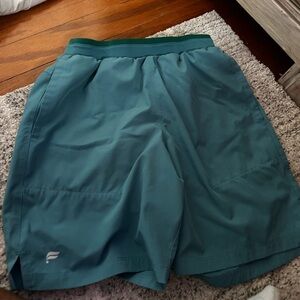 Fabletics lined cyan men’s shorts